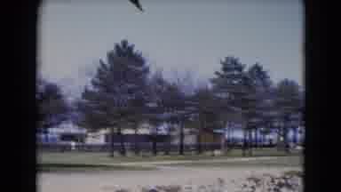 Middletown Pennsylvania (1975): Trees Line Buildings In The Distance Near The