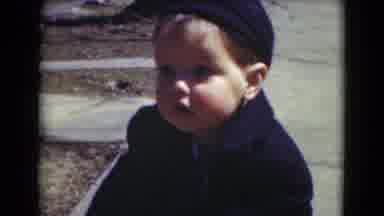 Middletown Pennsylvania (1975): Small Boy In Blue Hat And Jacket On Sidewalk Rosy