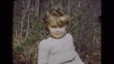 Middletown Pennsylvania (1975): A Little Girl Smiles In The Foreground With Ladies