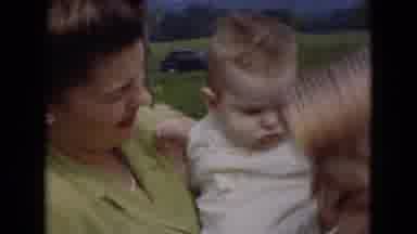 Middletown Pennsylvania (1975): Clip Of Mom In Floral Dress Holding Young Child