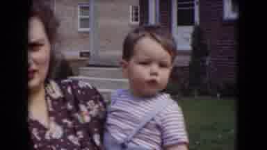 Middletown Pennsylvania (1975): Woman Holds Baby Who Waves At The Camera As