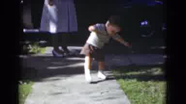 Middletown Pennsylvania (1975): A Child Walking His First Steps On The Pavement