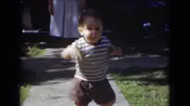 Middletown Pennsylvania-1975: Toddler Walks Down Walkway Toward Mother