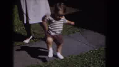 Middletown Pennsylvania (1975): Baby Walking A Few Step A Woman Standing Besides