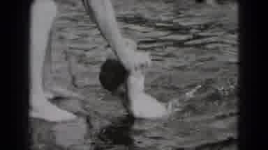 Middletown Pennsylvania (1975): Young Boy Securely Held Adult Bathing Attire