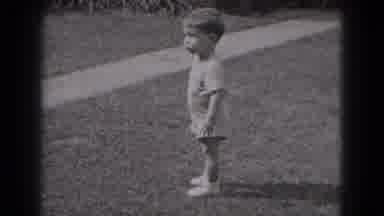 Middletown Pennsylvania-1975: Young Child Runs Around Outside On The Lawn On A