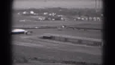 Middletown Pennsylvania (1975): Vehicles Slowly Moving Along A Road Behind A Very