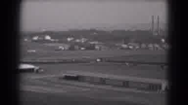 MIDDLETOWN PENNSYLVANIA-1975: Birds Eye View Of A Small Airplane Skillfully Landing