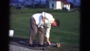 Middletown Pennsylvania (1975): Man Preparing His Golf Ball To Take A Golf Swing