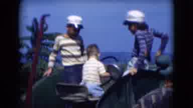 Middletown Pennsylvania (1975): Children Playing On Green Tractor Bouncing In Seat