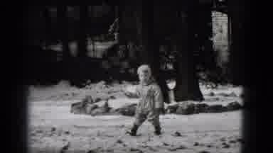 Middletown Pennsylvania (1975): Child Walks In Snow In Front Of White Buildings On