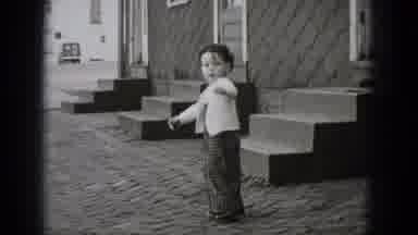 Middletown Pennsylvania (1975): Child In Overalls Standing In Front Of Three