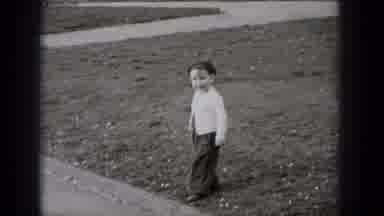 Middletown Pennsylvania (1975): Young Child Chases After A Squirrel Outside At The