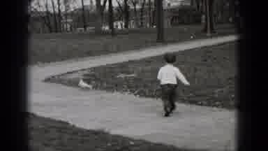 Middletown Pennsylvania (1975): Cute Little Boy Running Down A Sidewalk Attempting