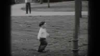 Middletown Pennsylvania (1975): Baby Wearing White Shirt With Black Pants Runs