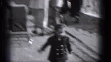 Middletown Pennsylvania (1975): Woman In A Long Coat Walking While A Little Child