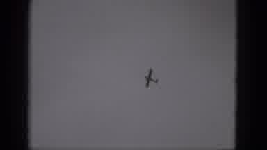 Middletown Pennsylvania (1975): Far View Of A Plane Flying In The Sky Slowly