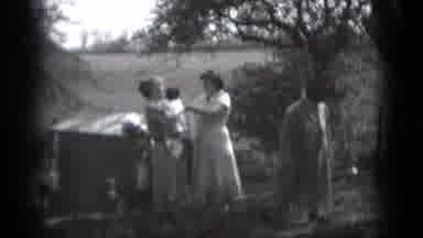 Middletown Pennsylvania (1975): Family Outside As Little Kid Plays With A Baby