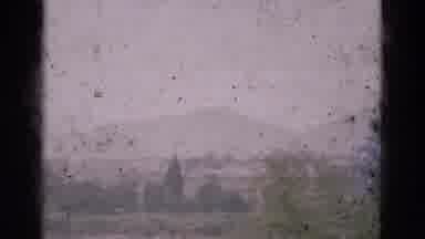 PORTUGAL-1975: A Dusty Window View of Distant Mountains and Forest