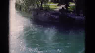 Portugal (1975): Beautiful Blue Water Rushes By A Lush Green Lawn And Many Tall