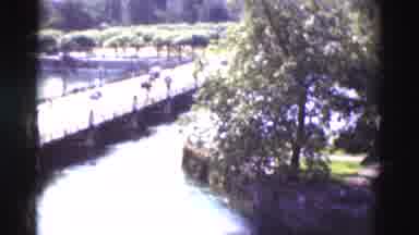 Portugal (1975): Old Time Cars Passing Each Other On A Bridge That Sits Low To The