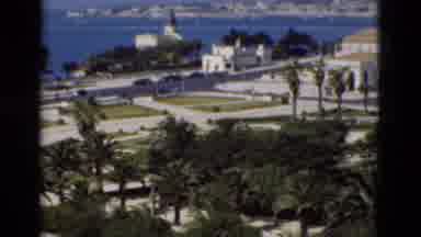 Portugal (1975): View Of Blue Sea And Coastal City On A Bright Sunny Day