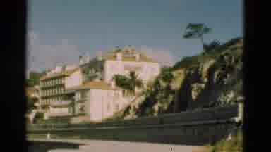 Portugal (1975): Bright Scene Of A White Building With Columns And Big Windows And