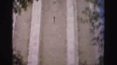 Florida Everglades USA (1975): Pan Of A Tan Brick And Stone Tower With Stained
