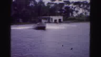 FLORIDA EVERGLADES USA-1975: Man Tries To Waterski Behind Boat Then Falls