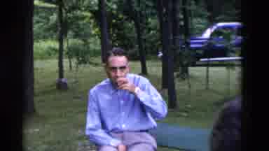 Somerset Kentucky USA (1975): A Man Is Being Filmed While Sipping A Drink And Two