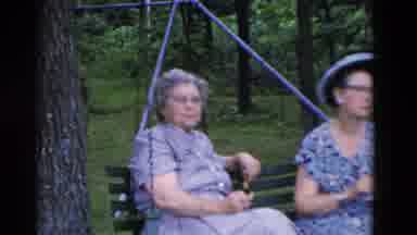 Somerset Kentucky USA (1975): Pair Of Women Wearing Blue Dresses Sit On Park Bench