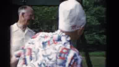 Somerset Kentucky USA (1975): Person Wearing White Hat Talks To People Eating At