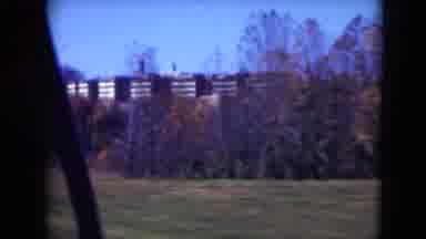 Middletown Pennsylvania (1975): Pan Of Grass Bushes Trees And Buildings Shot From
