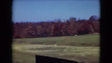 Middletown Pennsylvania (1975): Bridge Cut To A Truck Bed Driving By A Field With