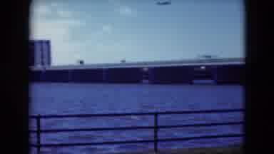 Middletown Pennsylvania (1975): Blue Water Flows Under A Long Bridge Next To A