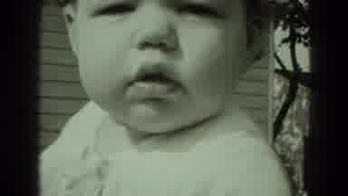 Middletown Pennsylvania (1975): A Baby In The Sun On A Windy Day Decides To Smile