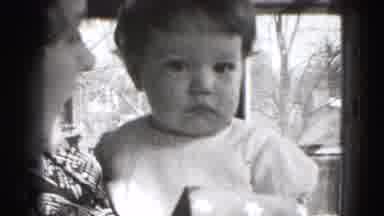 Middletown Pennsylvania (1975): Woman Holding And Talking To A Small Child Who Is