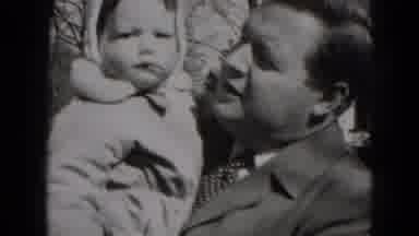 Middletown Pennsylvania (1975): Baby Holding Bouncing Man Kissing