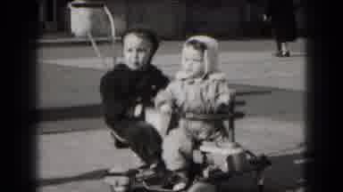 Middletown Pennsylvania (1975): Two Young Children Are Playing On A Scooter Then A