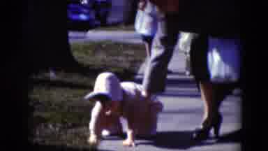 Middletown Pennsylvania (1975): Toddler Wearing Pink Coat Stumbles On Sidewalk On