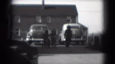 Middletown Pennsylvania (1975): Two Children Bundled Up And Racing Tricycles Down
