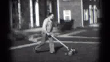 Middletown Pennsylvania (1975): Man Cuts Grass With Push Mower On A Bright Sunny