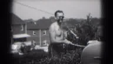 Middletown Pennsylvania (1975): Shirtless Man Smokes Huge Cigar And He Grills Food