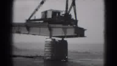 Middletown Pennsylvania (1975): A Small Boat Passing Under The Construction Area