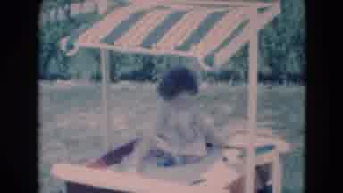 Middletown Pennsylvania (1975): Small Baby Plays In The Shade In A Sandbox With A