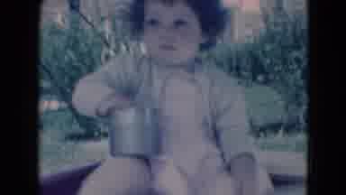 Middletown Pennsylvania (1975): Young Girl Sits Outside On A Breezy Day Playing