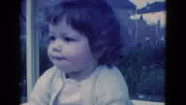 Middletown Pennsylvania (1975): Child In Suburban Neighborhood Sitting On Grass
