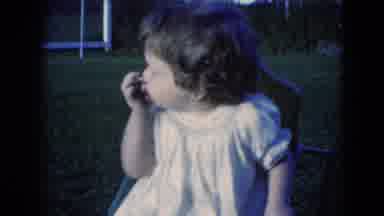 Middletown Pennsylvania (1975): Little Child Plays With Rocking Chair On Lawn In