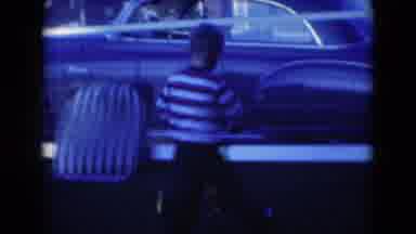 Middletown Pennsylvania (1975): Young Boy Pushing Lawn Mower Toy On Grass Outside