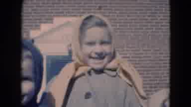 Middletown Pennsylvania (1975): Three Children In Coats In Front Of A Brick